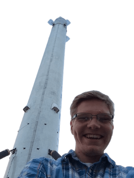 Brian Abbott, foreground and spacex falcon 9 rocket behind. Background transparent.